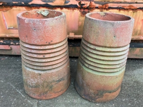 A pair of ribbed chimney pots