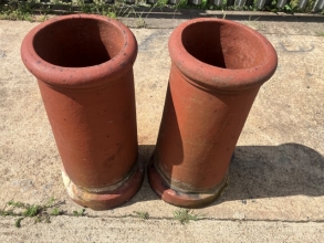 A pair of terracotta chimney pots