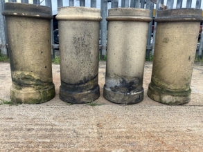 Four buff chimney pots