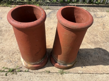 A pair of terracotta chimney pots