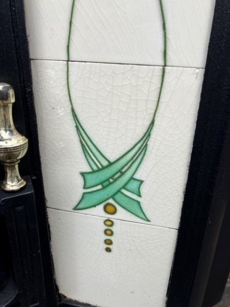 Art Nouveau cast iron tiled insert