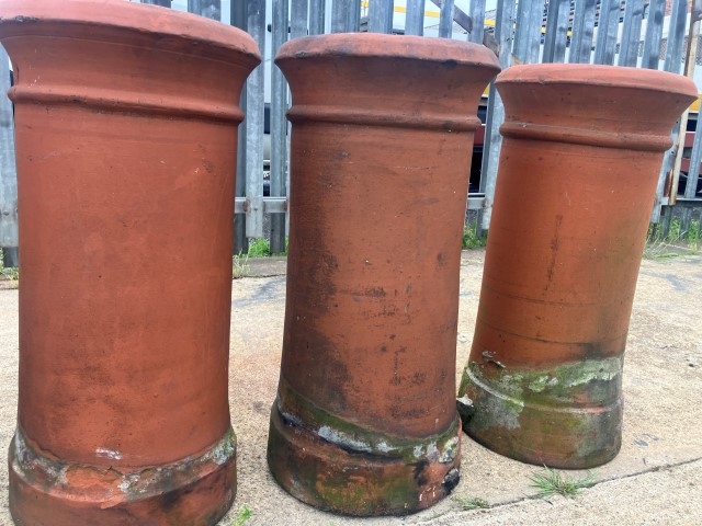 A set of four terracotta chimney pots