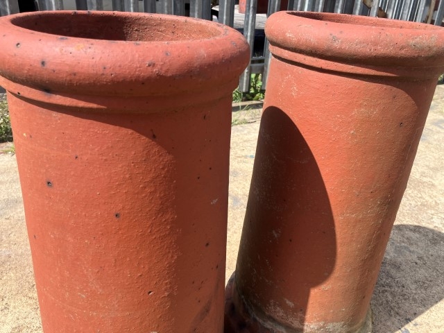 A pair of terracotta chimney pots