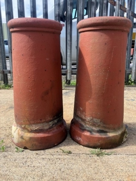 A pair of terracotta chimney pots
