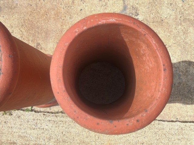 A pair of terracotta chimney pots