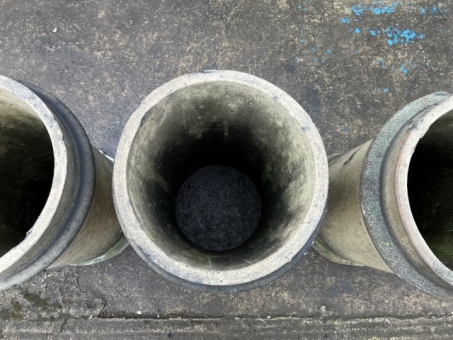 Buff cylindrical chimney pots