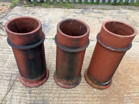 Trio of terracotta chimney pots