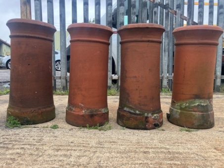 A set of four terracotta chimney pots