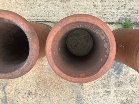 A set of four terracotta chimney pots