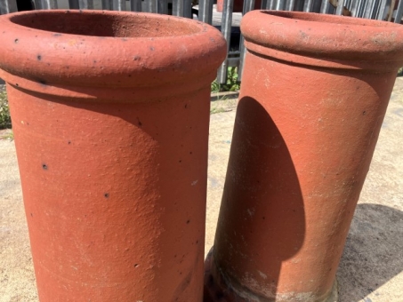 A pair of terracotta chimney pots