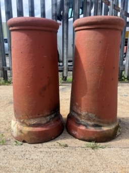 A pair of terracotta chimney pots