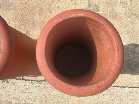 A pair of terracotta chimney pots